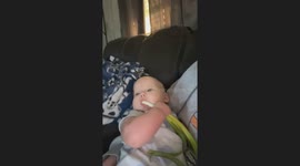 Baby uses green onion as pacifier in California, USA