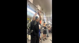 Man gets hand stuck on subway handrail in Guangdong, China