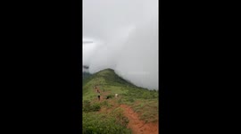 Hikers engulfed by heavy fog in Guangxi, China