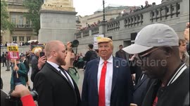 lookalike Donald trump turns up for the protest in central London.