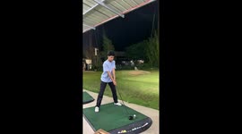 Golf beginner lets go of club and it lands on another player at driving range