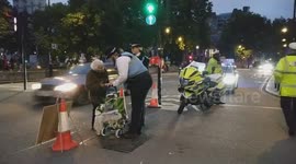 KINDNESS in action: London Police officers assist elderly woman after Anti-Trump rally