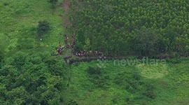 Riot police clash with Cambodian villagers trying to break down border wall