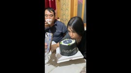 Father playfully smashes cake on daughter’s front in Xinjiang, China
