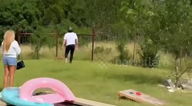 Man rescues fawn stuck in fence in Fredericksburg, Texas, USA
