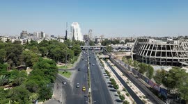 Syria: Aerial views of Damascus with national flag