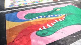 US: Artists paint parking spaces in honor of LGBT pride at Se7en Bites