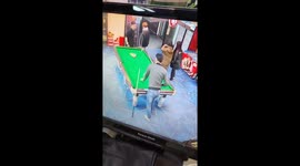 Pool player lands cue ball in passerby's pocket
