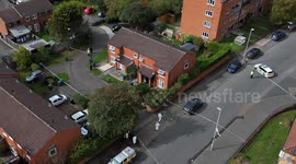 Police seal off road as murder investigation is launched following Birmingham house fire