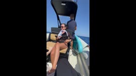 Ribbon sash flies into the sea during boat ride in Crete, Greece