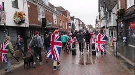 Protestors march through Canterbury high street in Kent, UK