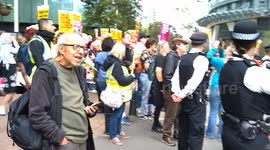 pro migrant rally outside the Britannia Hotel in Canary Wharf