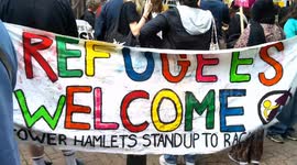 pro migrant rally outside the Britannia Hotel in Canary Wharf
