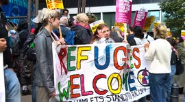 pro migrant rally outside the Britannia Hotel in Canary Wharf