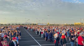 A sea of people gather in the parking lot of Charlie Kirk Memorial