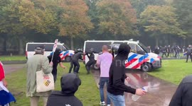 Dutch police clash with anti-immigration protesters in Amsterdam, Netherlands