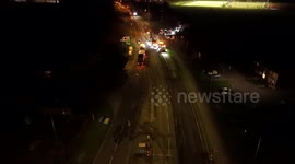 Road re-servicing by a main traffic lights at night in Aylesbury