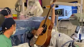 Dad plays guitar during brain surgery to remove tumour