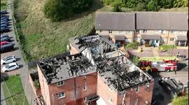 drone footage: Three children taken to hospital after fire tears through three-storey block of flats in Enfield