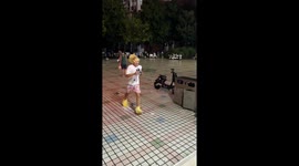 Man playfully slips on tiled floor in Henan, China