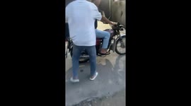Motorbike lifts onto one wheel in funny mishap in Guangdong, China