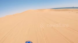 Launching my Yamaha over a 30-meter dune jump on Namibia’s wild coastline