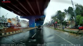 Scooter Loses Control on Wet Road