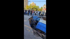 Cars and lorry plunge into sinkhole in China