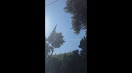 Helicopter knocks branches onto moving vehicle during firefighting operation in Greece