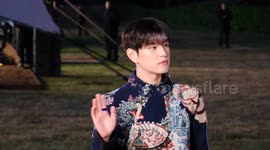 Fans scream for K-pop singer Seungmin of Stray Kids as he arrives at the Burberry fashion show in London's Kensington