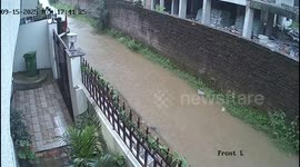 India: A wall collapses on a woman during heavy rains, narrowly escaping her death