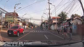 Motorcycle passenger's helmet topples off her head
