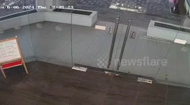 Glass door mysteriously opens and shatters on impact