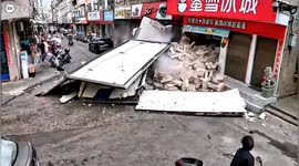 Truck carrying shrimp loses brakes on steep road and smashes into bubble tea store in China