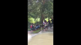 Wife furious as husband rescues motorcycle instead of her during floods