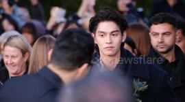 K-pop crazy: Fans scream as singer Seungmin of Stray Kids arrives at the Burberry catwalk show in London with other brand ambassadors following on
