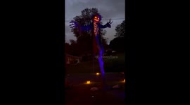 Giant Animatronic Scarecrow at Night