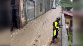 Italy: Cars Submerged In Channel As Firefighters Battle Flooded Streets In Lombardy