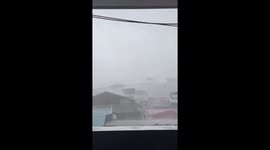 Debris flies through the air during Typhoon Ragasa carnage in the Philippines