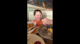 Boy reacts to tasting oyster in New Smyrna Beach, USA