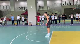 Man makes impressive long-distance basketball shot in Guangdong, China