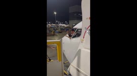Captain waves to passengers from plane window