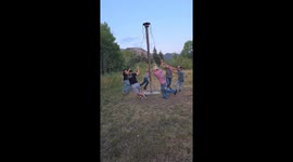 Men Play On Redneck Merry-Go-Round