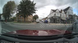 London moped rider pulls phone from helmet after crashing into car pulling out of road
