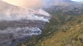 Spain: Wildfire Fighters Battle Flames From Air In Peñalba de la Sierra