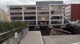 Bangkok sinkhole widens swallowing electric poles