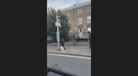 Shocking moment knife-wielding youth chases after teens in middle of Brixton street as terrified bystanders scream