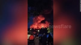 Video captures industrial building engulfed in flames