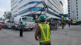 Engineers plug botched underground train line with concrete after sinkhole on Bangkok road