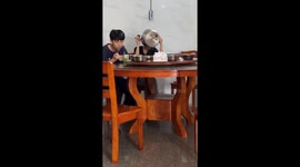 Woman chugs pot of soup with cheeks full in Fujian, China